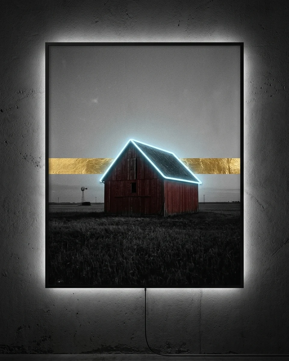 Prairie — A lone barn in a Midwest wheat field, printed like an old black-and-white photograph, with only the red walls and a band of gold leaf above the horizon in color, neon wall art panel